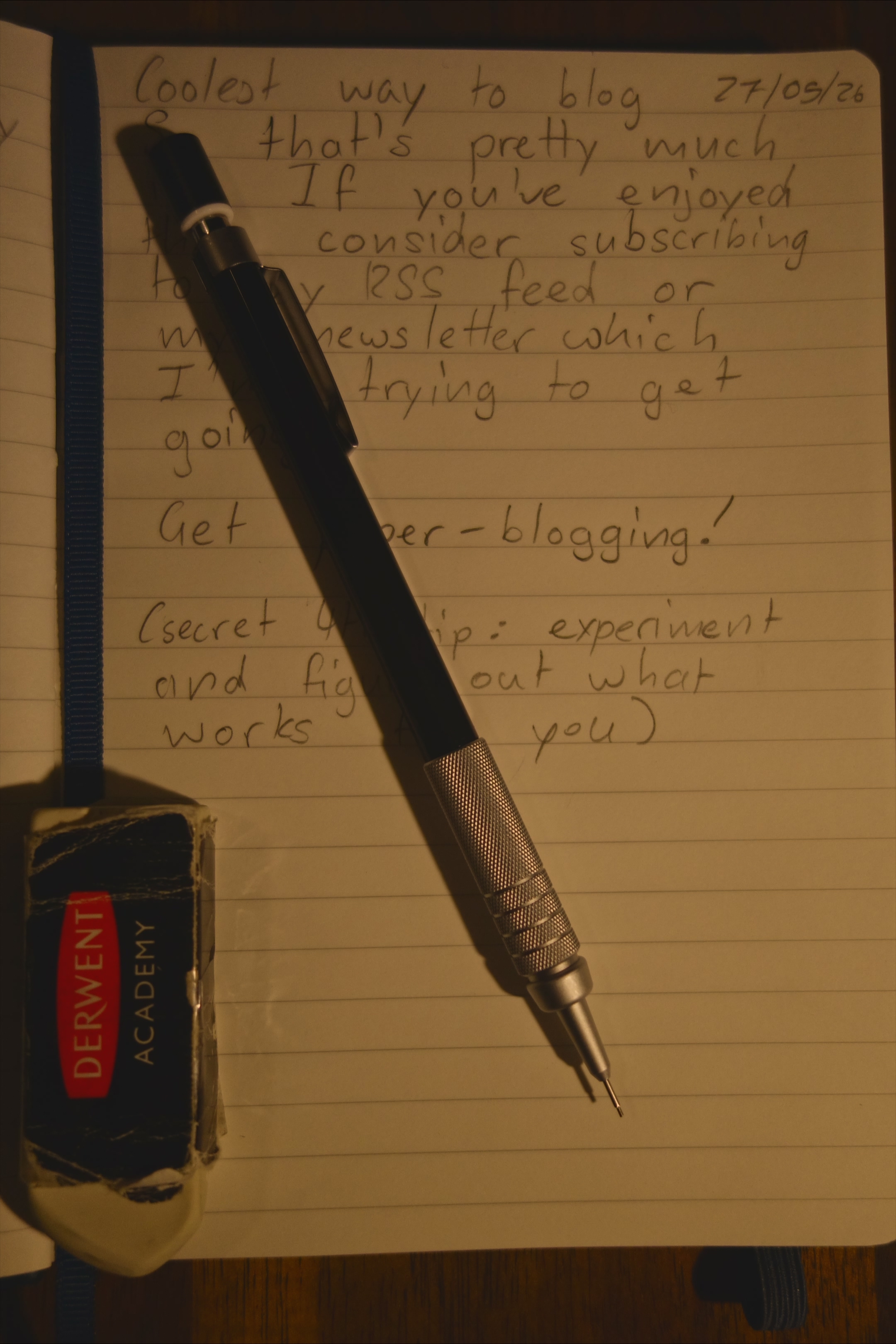 Blogging tools: a notebook, mechanical pencil and eraser.